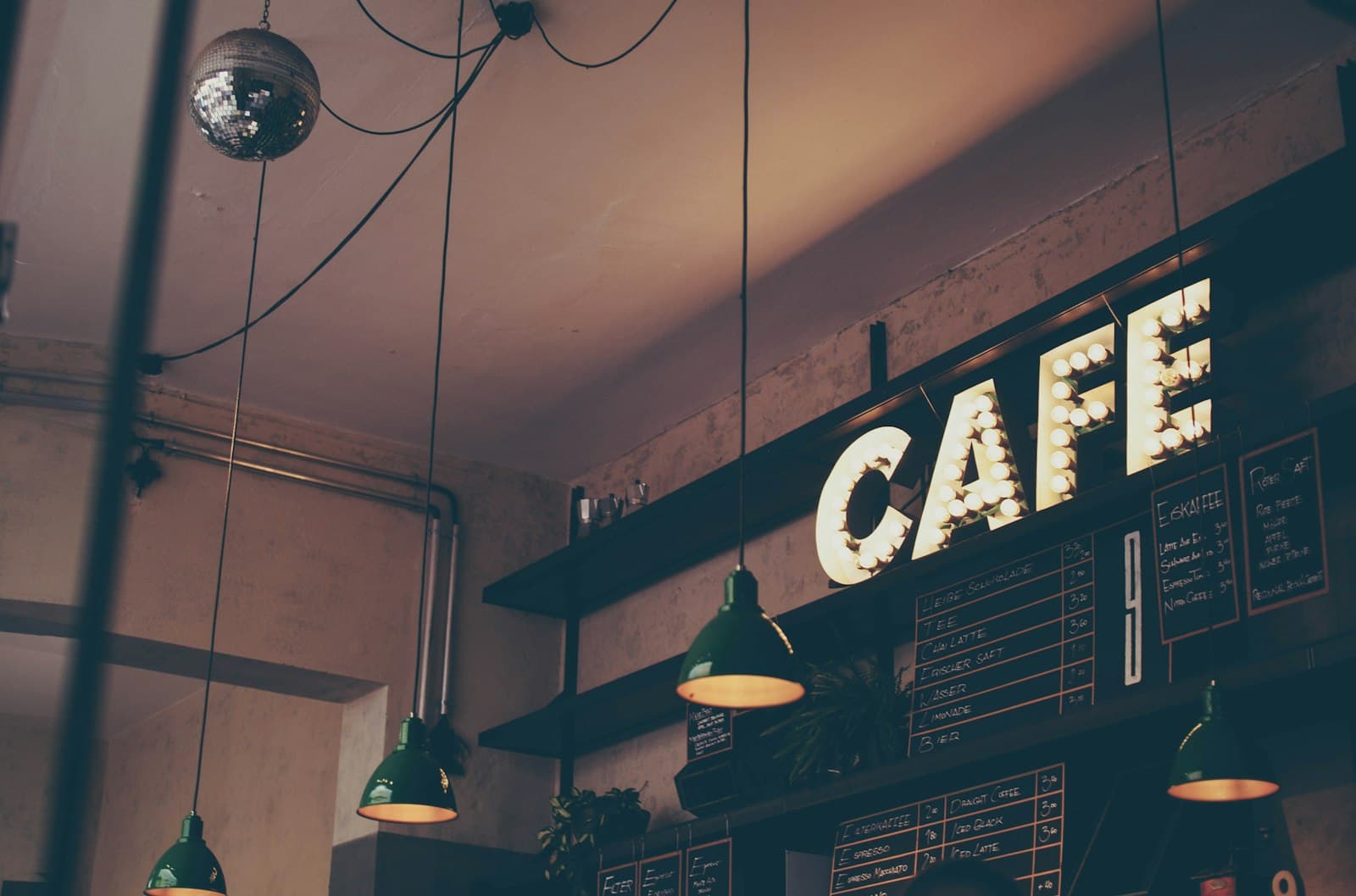 Warm pendant lights above the café counter