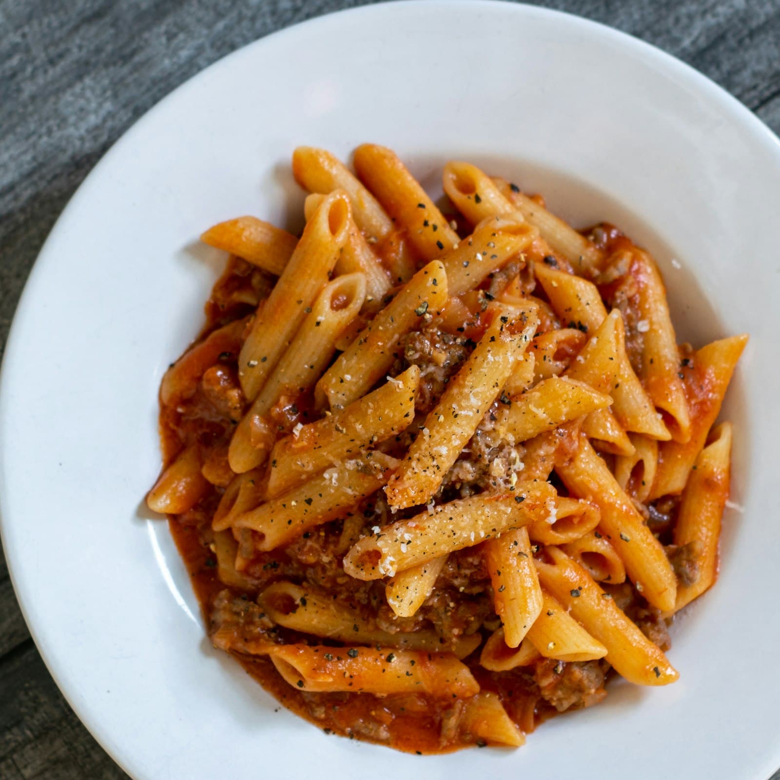 A bowl of pasta finished with herbs