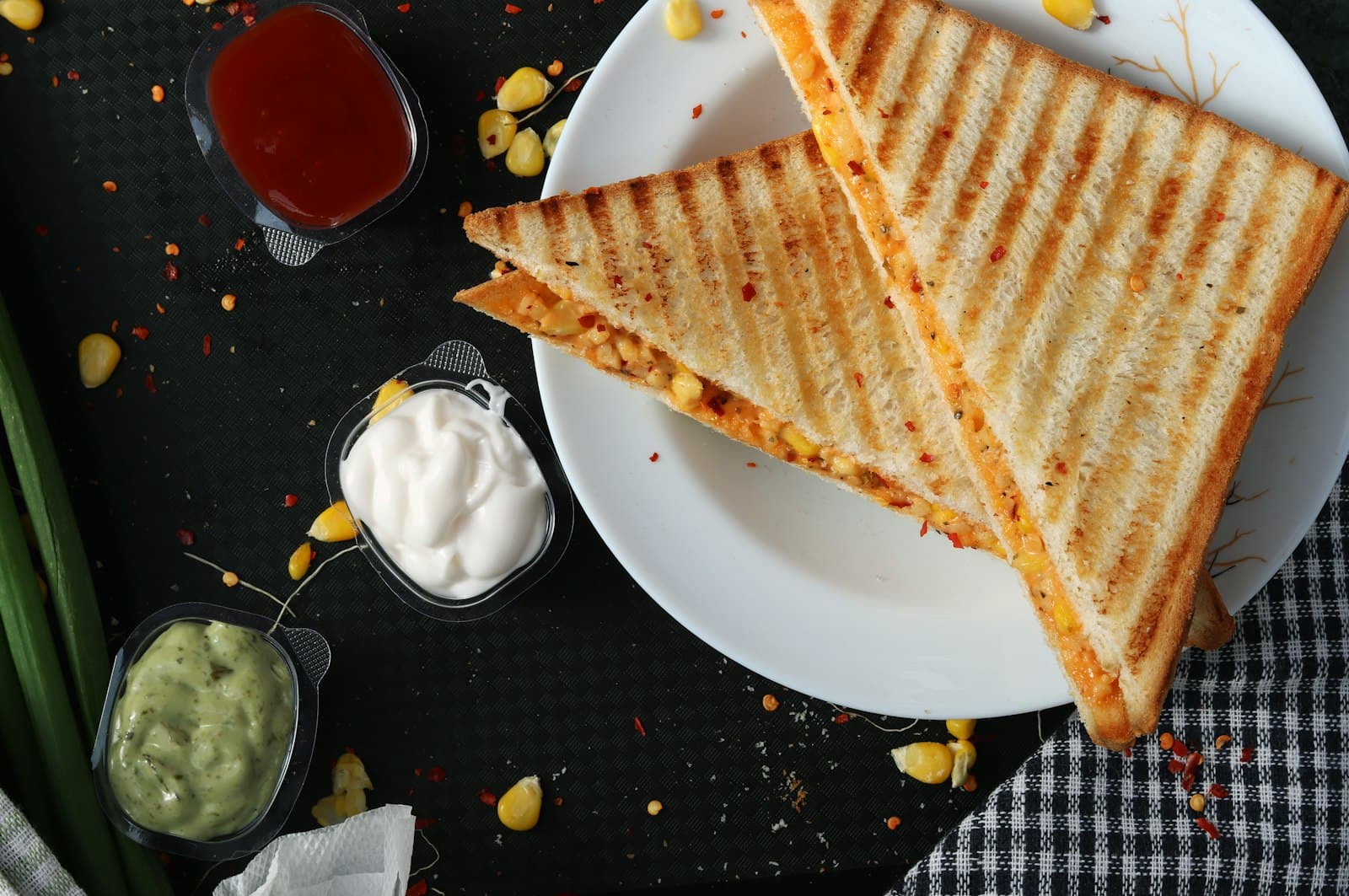 A stacked café sandwich on a wooden board