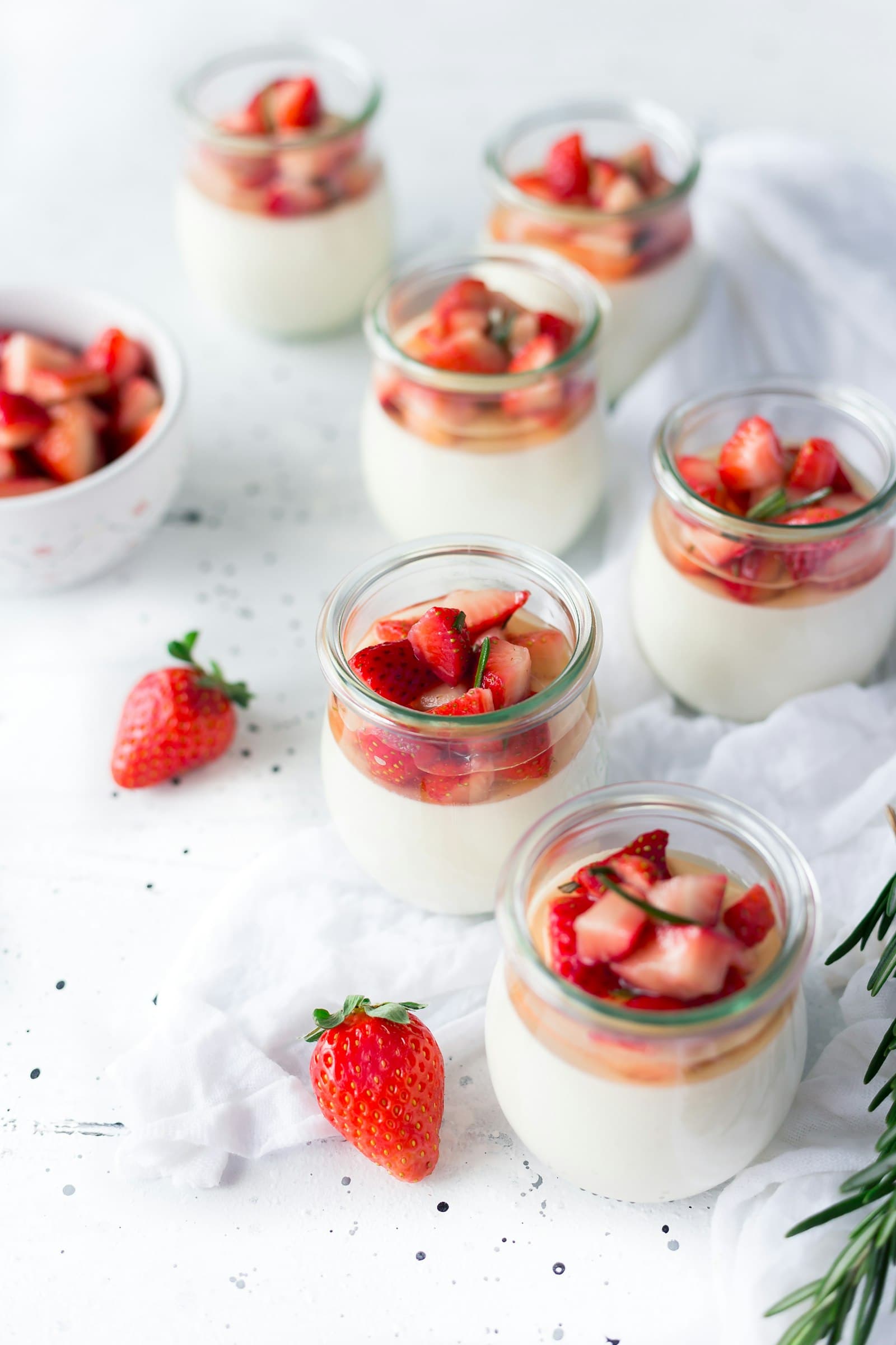 A glass of layered berry dessert